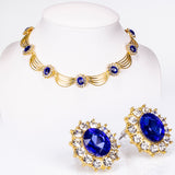 Set din Aliaj Placat cu Aur ( 60 grame ) cu Cristal Albastru Emporia® și Cristal Alb Emporia® ( Colier+Cercei )