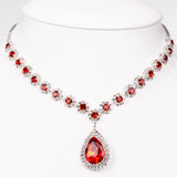 Geantă din Aliaj Placat cu Aur ( 225 grame ) cu Cristal Roșu Emporia® și Cristal Alb Emporia® ( Colier+Cercei+Brățară+Inel )