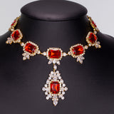 Set din Aliaj Placat cu Aur ( 28 grame ) cu Cristal Roșu Emporia® și Cristal Alb Emporia® ( Colier+Cercei )