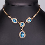 Set din Aliaj Placat cu Aur ( 32 grame ) cu Cristal Albastru Emporia® și Cristal Alb Emporia® ( Colier+Cercei+Brățară )