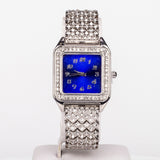 Ceas din Aliaj Placat cu Aur ( 57 grame ) cu Cristal Albastru Emporia® și Cristal Alb Emporia® 12 Carate ( Colier+Cercei+Pandantiv )